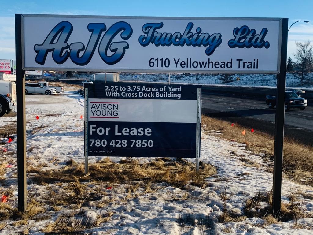 AJG Trucking post-and-panel sign on Yellowhead Trail