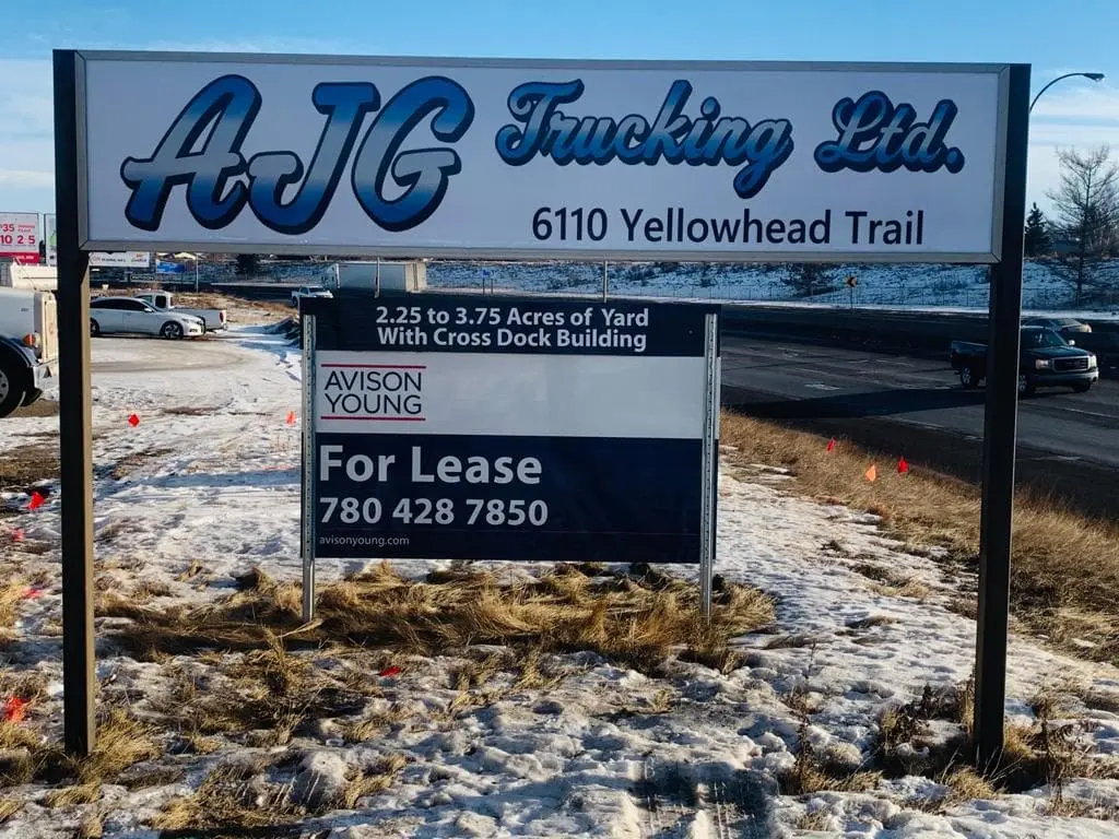 AJG Trucking post-and-panel sign on Yellowhead Trail