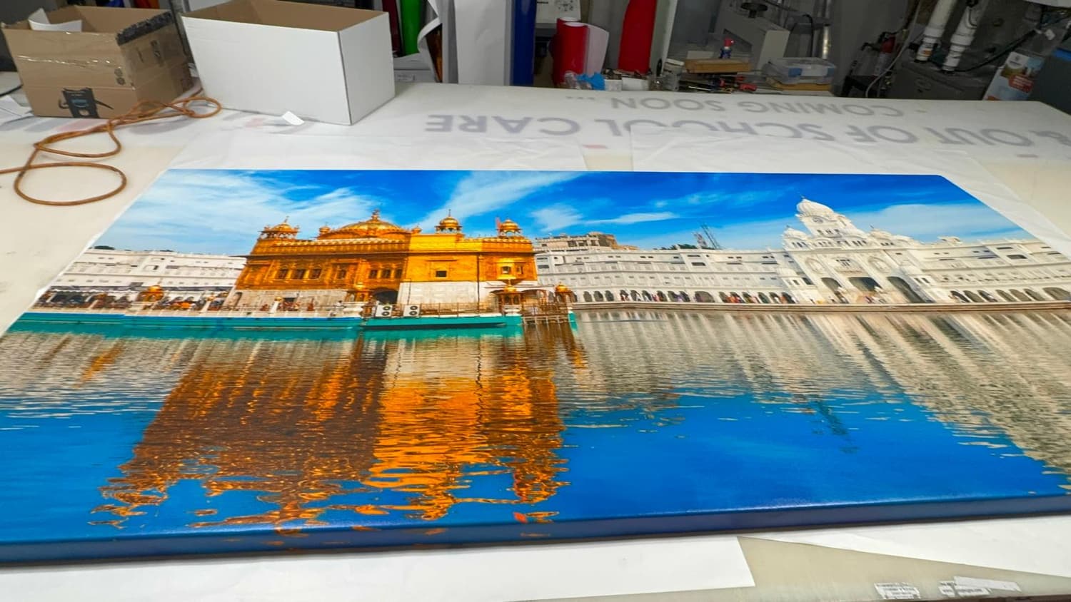 Large gallery-wrapped canvas print of the Golden Temple on the shop table