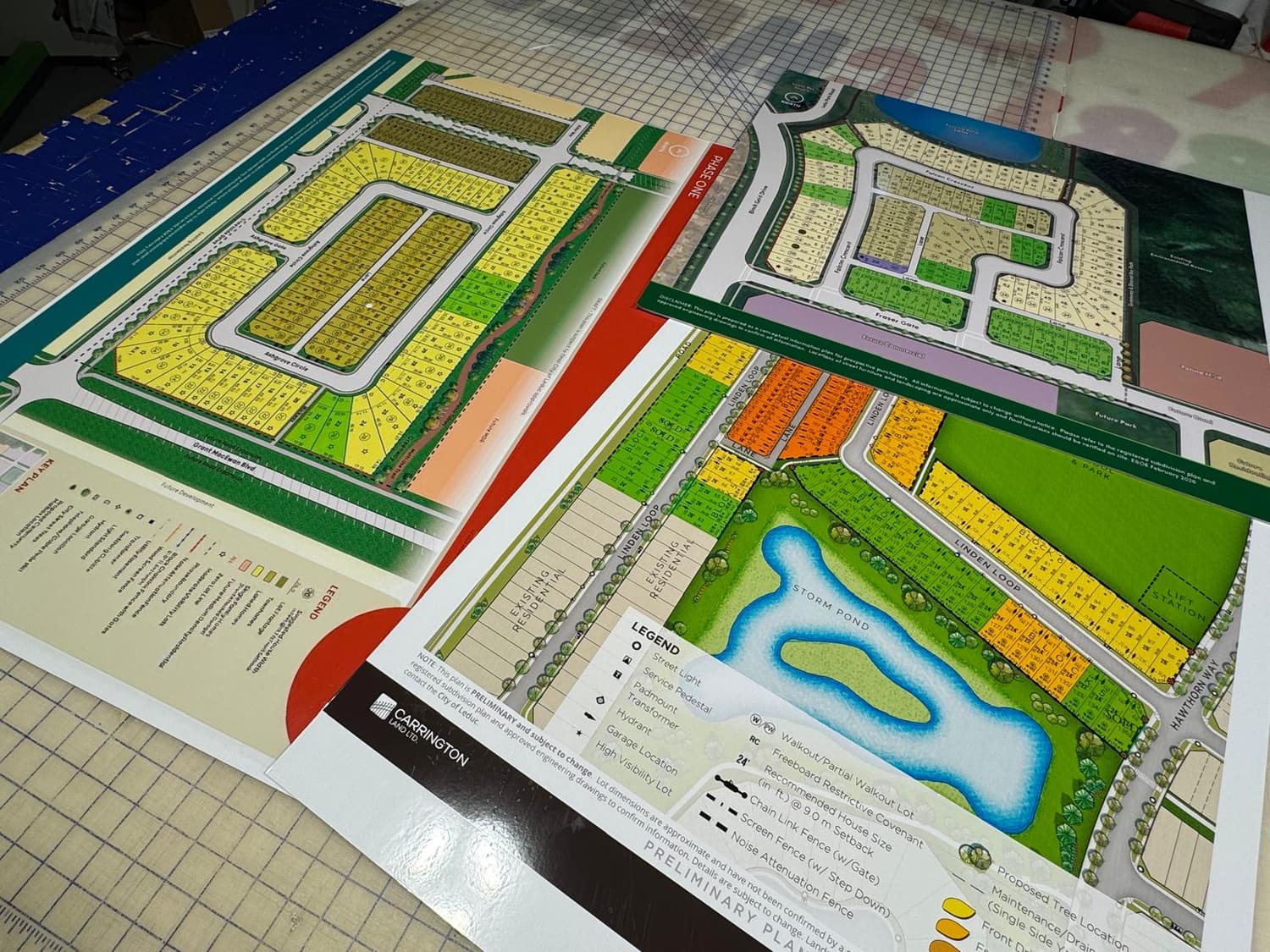Mounted development site plan prints on the cutting table
