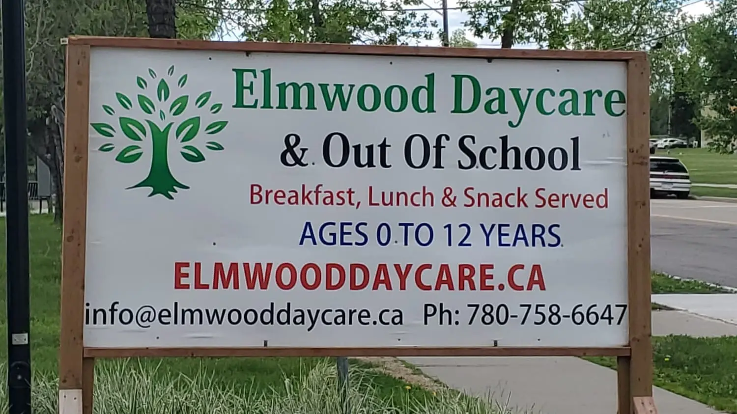 Elmwood Daycare wood-framed sign
