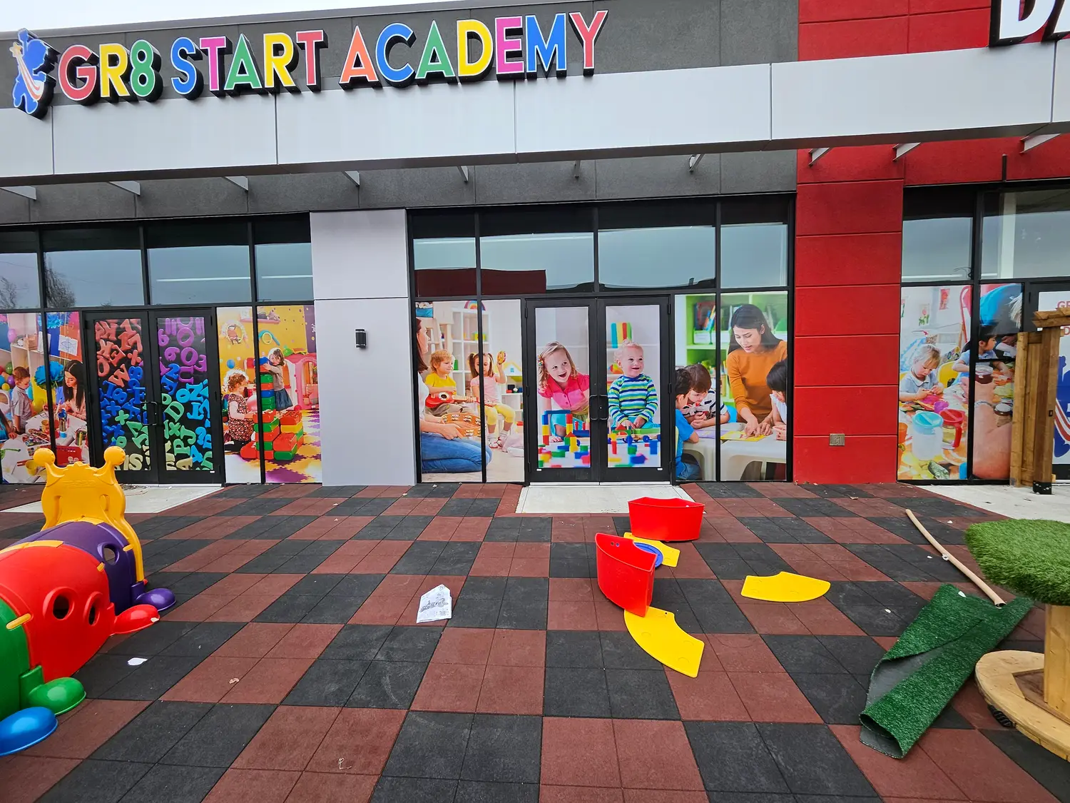GR8 Start Academy storefront with colourful channel letters and full-window printed graphics