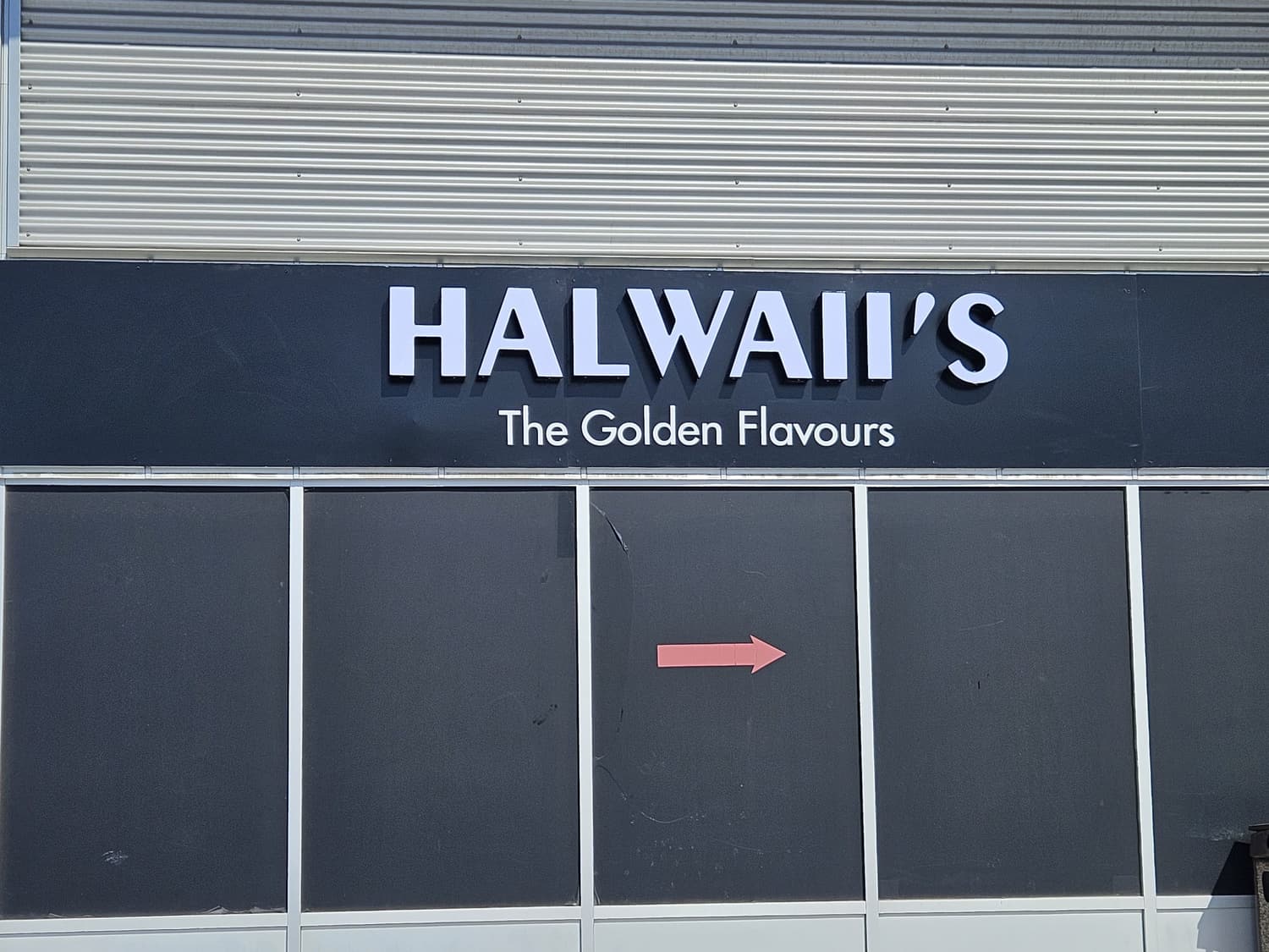 Halwaii's illuminated channel letters on black fascia