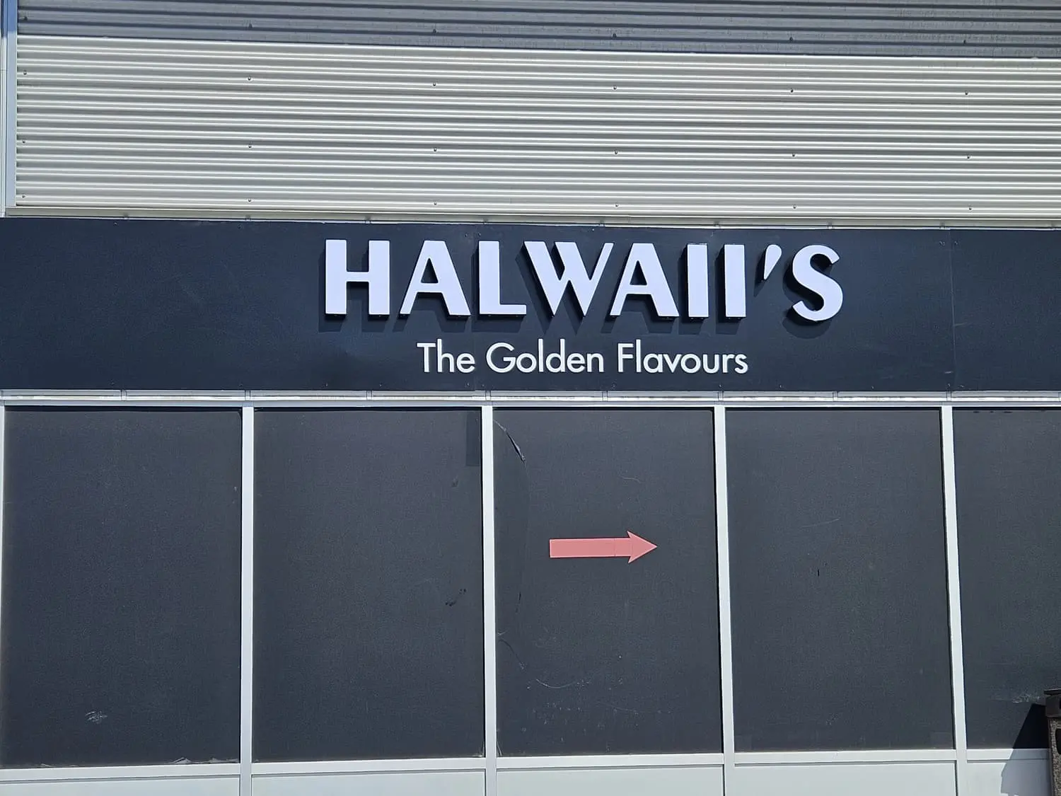 Halwaii's illuminated channel letters on black fascia