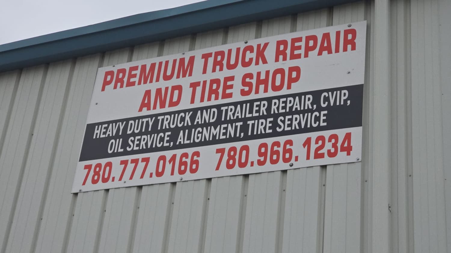 Premium Truck Repair and Tire Shop wall sign