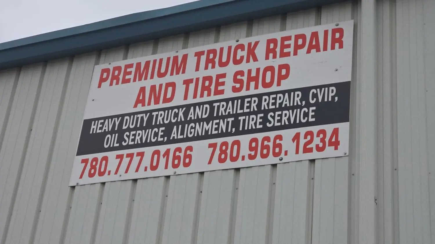 Premium Truck Repair and Tire Shop wall sign