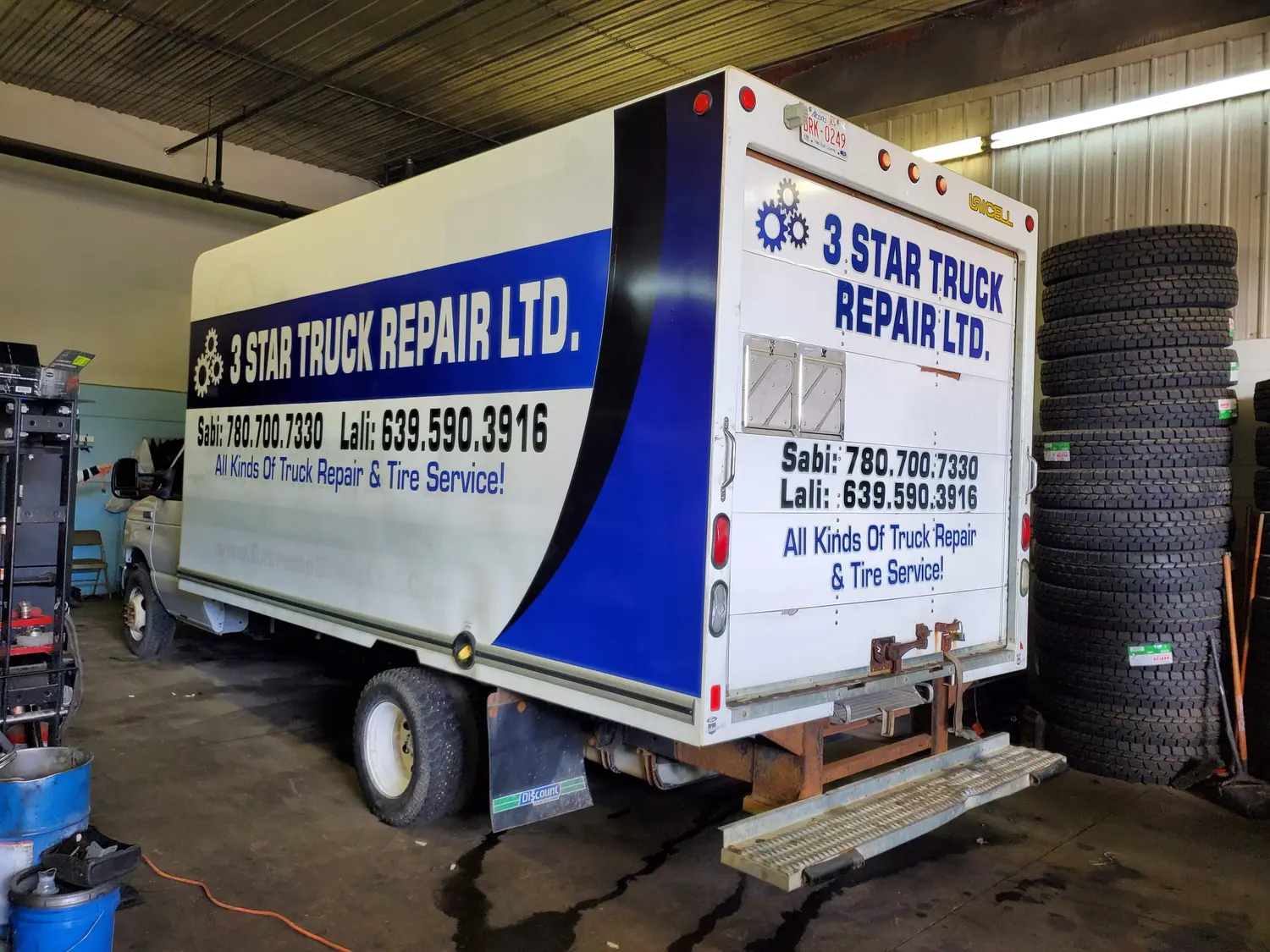 3 Star Truck Repair graphics on a cube van