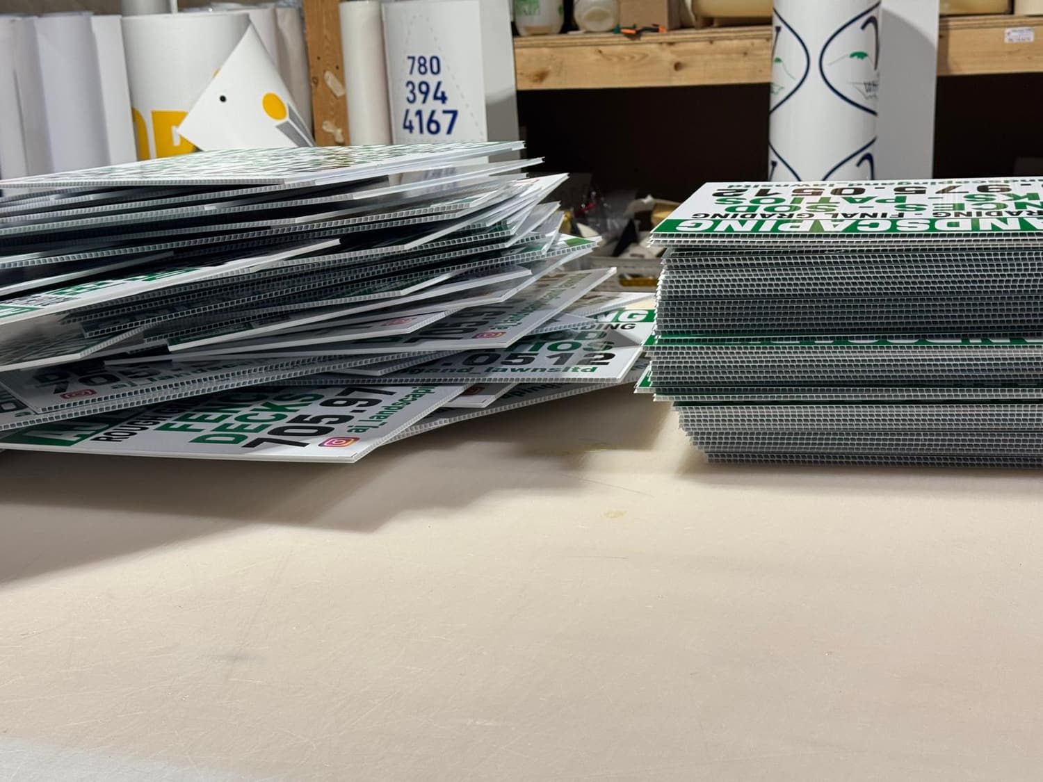 Stacks of printed coroplast yard signs ready for pickup